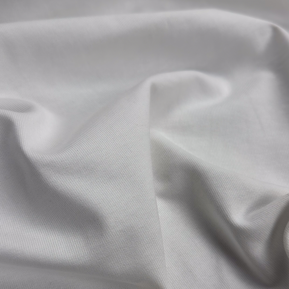 Premium-Jerseystoff in Naturweiß, 100 % Baumwolle, 290 g/m², 195 cm breit – ideal für T-Shirts und Longsleeves.